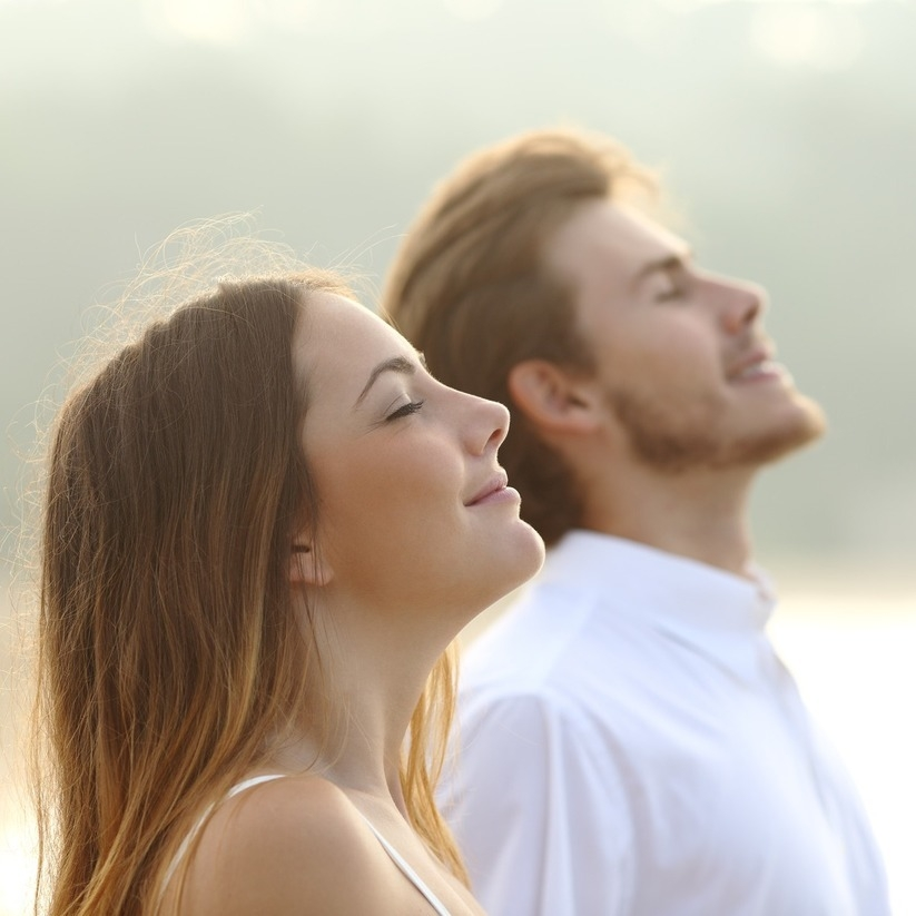 couple-of-man-and-woman-breathing-deep-fresh-air-m